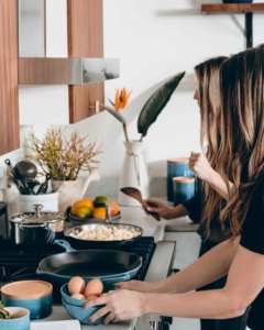 family cooking a meal together, learning how to cook