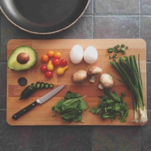 cutting board with various food items on it ready to cook