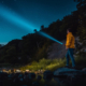 flashlight at night looking at the stars along the river