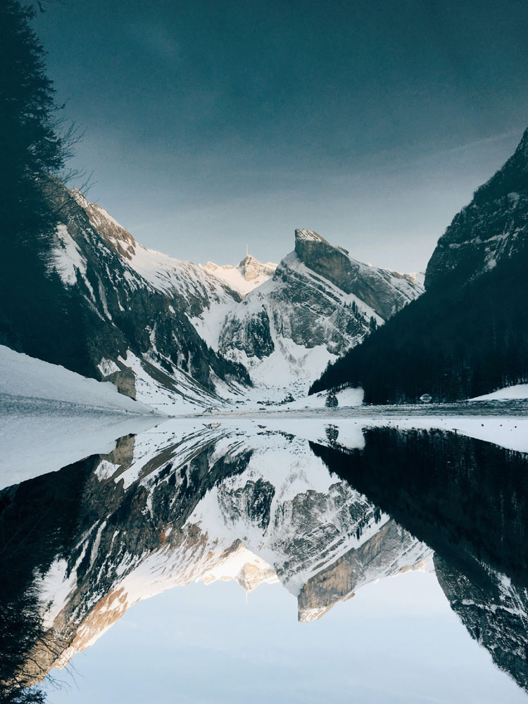 winder scape of mountains reflecting in the lake